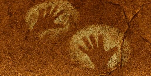 Ancient handprint on cave wall.