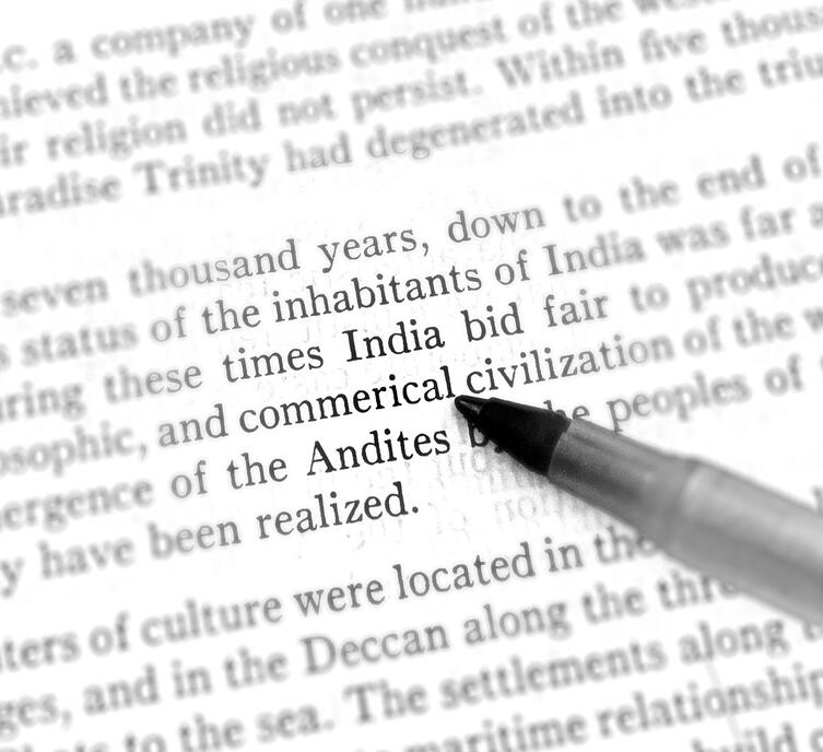 Photograph of the word commercial incorrectly spelled in printed text